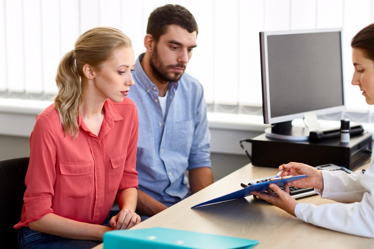 A couple consulting with a doctor | Source: Shutterstock